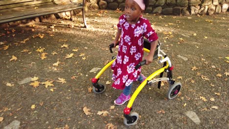 Black-girl-with-Cerebral-Palsy-walking-in-the-park-with-her-assistive-device-2