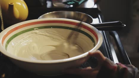 Mixing-Well-The-Pancake-Batter-With-An-Egg-Beater-In-A-Mixing-Bowl-Until-Smooth---Close-Up-Shot