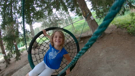 Happy-young-girl-on-hammock-web-swing