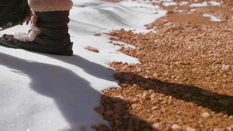 Girl-woman-hiking-with-red-rocks-formation-and-snow-near-Bryce-Canyon-in-southern-Utah-4