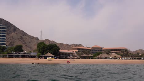 Exterior-shot-of-a-beach-resort-in-the-Fujariah-coastline-in-a-calm-afternoon
