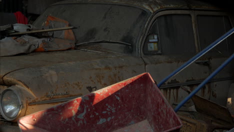 Rusty-old-car-left-to-degrade-in-a-garage