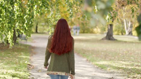 4K-Slow-Motion:-Beautiful-young-redhead-woman-walking-away