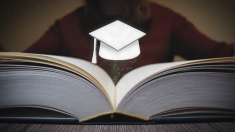 Graduation-cap-appears-from-a-book-when-it-is-opened