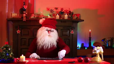 Santa-Claus-Showing-Subscribe-Note-On-Chalk-Blackboard