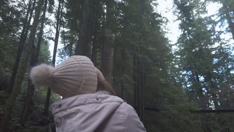 Girl-in-forest-looking-up