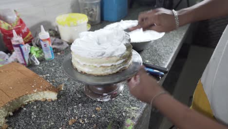 A-Confectioner-Making-A-Cake-Base,-She-Pours-The-cream-Into-A-Cake-Pan-4K