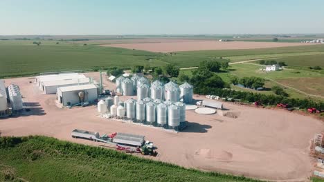 Aerial-view-of-the-storage-bins,-warehouses,-tractors-and-trailers-of-a-cover-seed-agribusiness-in-Nebraska-USA,-but-exports-seeds-around-the-world-4