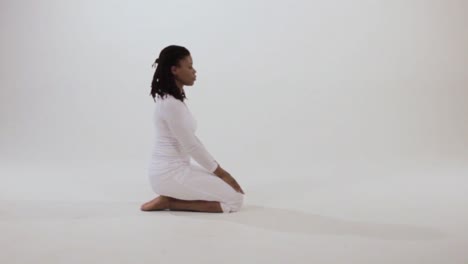 A-Black-yogini-peacefully-moves-into-Vajrasana-or-Thunderbolt-pose