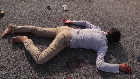 Crime-Scene-concept,-Establishing-shot-of-dead-body-laying-on-road-at-hot-sunny-day