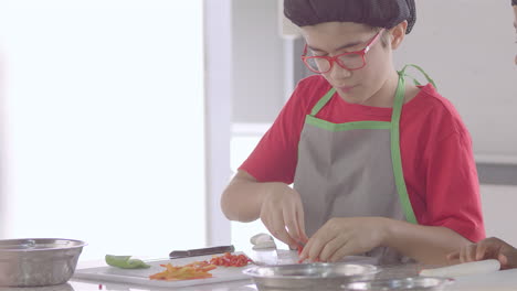 Chef-kid-cooking,-cutting-and-baking,-minichef-25