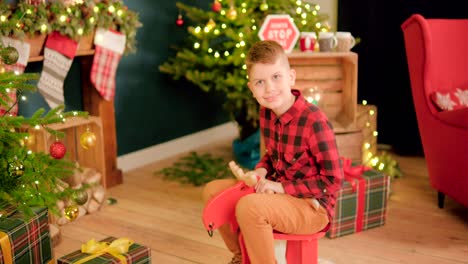 Young-boy-enjoys-sitting-on-a-rocking-horse-and-sways-back-and-forth
