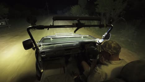 A-night-safari-driver-navigates-his-Land-Cruiser-through-the-grasslands-of-South-Africa