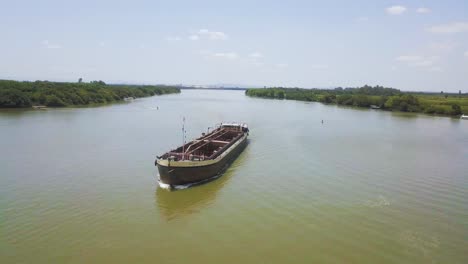 Large-Barge-traveling-down-Jacui-River,-Brazil