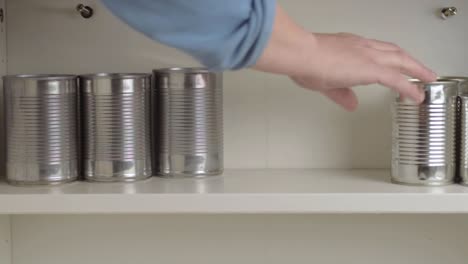 Getting-aluminum-tin-cans-out-of-food-cupboard-shelf