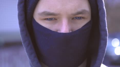 Young-Handsome-Man-With-His-Hoodie-Wearing-A-Black-Protective-Facemask-During-The-Coronavirus-Outbreak