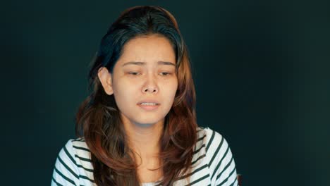 Indian-north-east-asian-woman-dealing-with-anxiety-depression,-portrait-shot