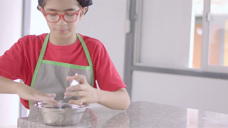 Chef-kid-cooking,-cutting-and-baking,-minichef-19