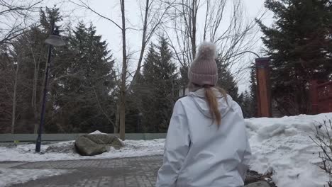 Young-women-walking-on-snowy-day