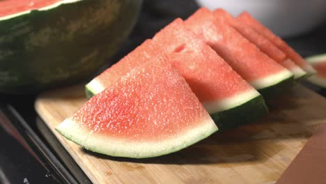 Thick-Triangle-Shape-Slices-Of-Sweet-Fresh-Watermelon---Closeup-Panning-Shot