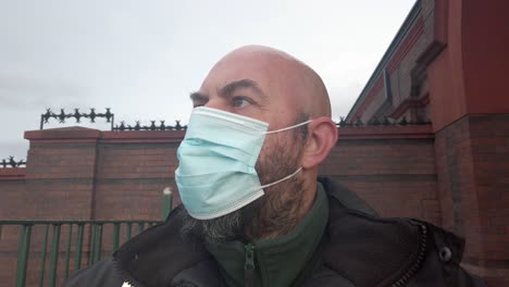 Male-guard-wearing-protective-corona-virus-medical-PPE-mask-closeup