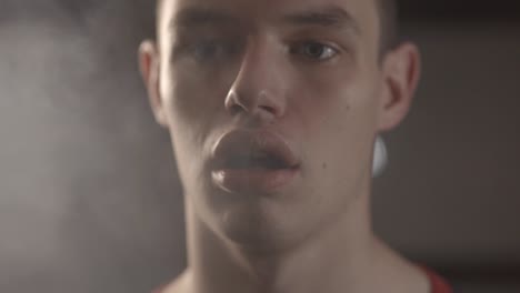 Closeup-Of-A-Young-Man-Vaping-With-White-Smoky-Air-Coming-From-His-Mouth---Slow-Motion