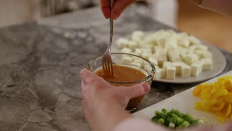 Woman-Stirring-Sauce-For-Meal-In-Slow-Motion
