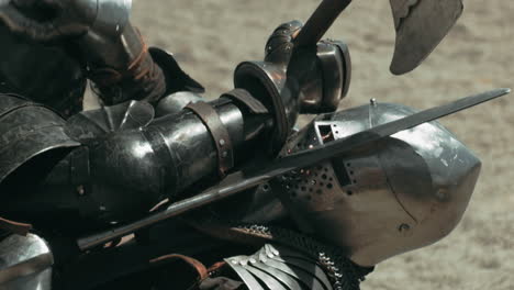 Close-up-shot-of-knight-killing-opponent-after-fight