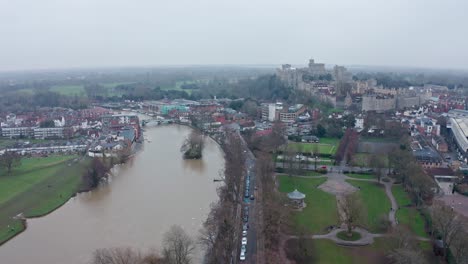 Cinematic-rotating-aerial-drone-shot-of-thames-river-connecting-Eton-and-Windsor