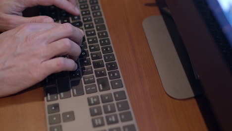 Closeup-of-a-man's-hands-typing-on-a-keyboard