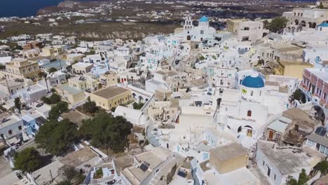4k-aerial-drone-view-of-Pyrgos-Pirgos-Santorini-white-houses-greek-island