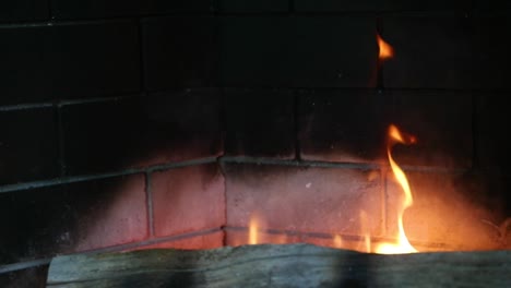 Close-Up-Of-Smoke-Coming-From-Burning-Fireplace-In-Slow-Motion