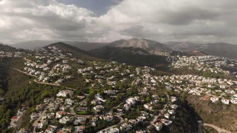 Establishing-4k-Aerial-shot-view-of-houses-of-suburban-neighborhood-in-Pego,-Alicante,-Spain,-wide-angle-approach