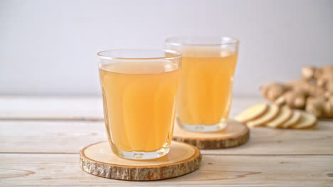 Fresh-and-hot-ginger-juice-glass-with-ginger-roots---Healthy-drink-style