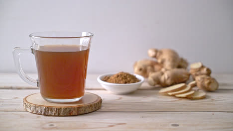 Hot-and-sweet-ginger-juice-glass-with-ginger-roots---Healthy-drink-style