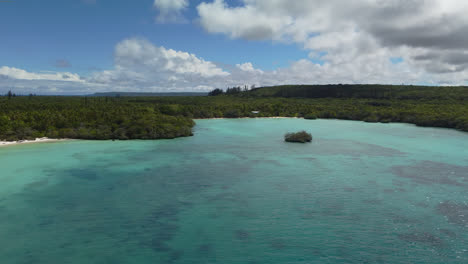 Tropical-New-Caledonia-island-turquoise-sea-and-idyllic-quiet-beaches,-4K-aerial