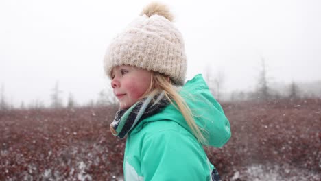 Epic-little-girl-running-in-snowstorm-cinematic-super-slomo