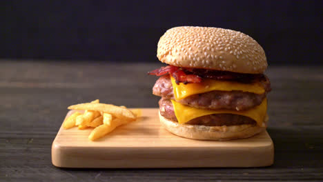 Pork-hamburger-or-pork-burger-with-cheese,-bacon-and-french-fries