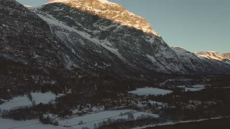 Sun-Shining-Through-Mountainside-In-Norway---aerial-shot