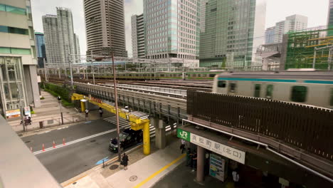 Toyko-Subway-Trains-Pass-Over-Street-On-Elevated-Track