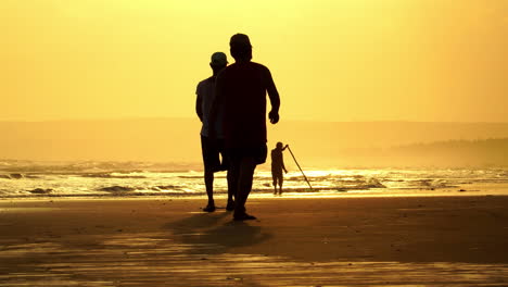 Fisherman-collecting-shellfish-during-sunset