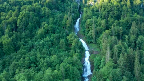 Drone-flight-over-a-stunning-alpine-mountain-water-fall