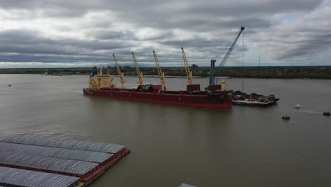 Aerial-video-of-a-ship-being-loaded-on-the-Mississippi-River-in-Louisiana