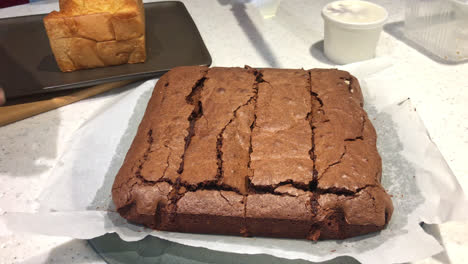 Knife-cutting-chocolate-brownies-cake