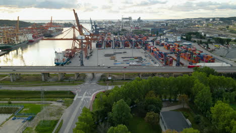 Aerial-flight-towards-giant-Dockyard-in-Gdynia-during-sunrise