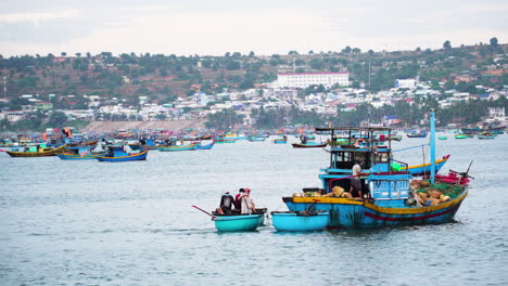 Colorful-Vietnamese-fishing-boat-sailing-in-harbor-of-Mui-Ne-fishing-town
