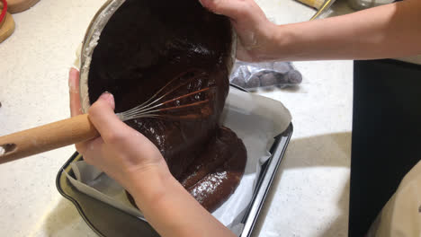 Pouring-chocolate-on-block-for-making-brownies