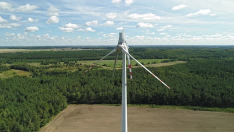 Wind-Turbines-With-Damaged-Blades-Against-Lush-Vegetation-In-Wiatrak,-Poland