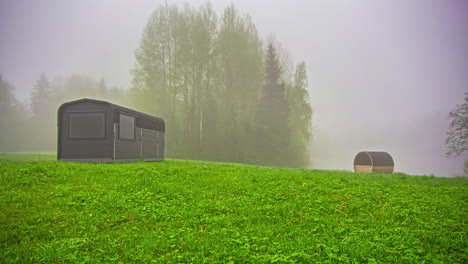 Foggy-Morning-Timelapse-Of-Campsite-With-Sauna-In-The-Summer