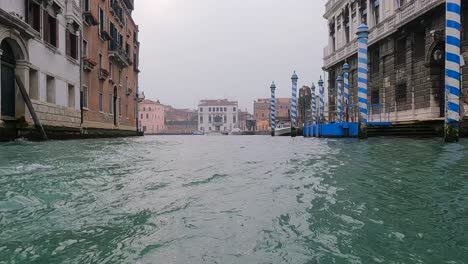 Water-surface-pov-of-Venice-cityscape-seen-from-ferry-boat,-Italy
